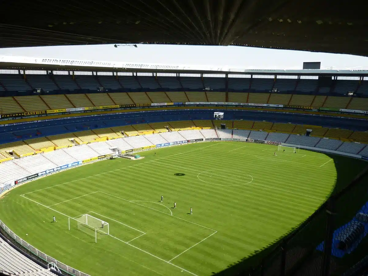 Empty Sinigaglia stadium celebrating Como victory with confetti and scattered scarves