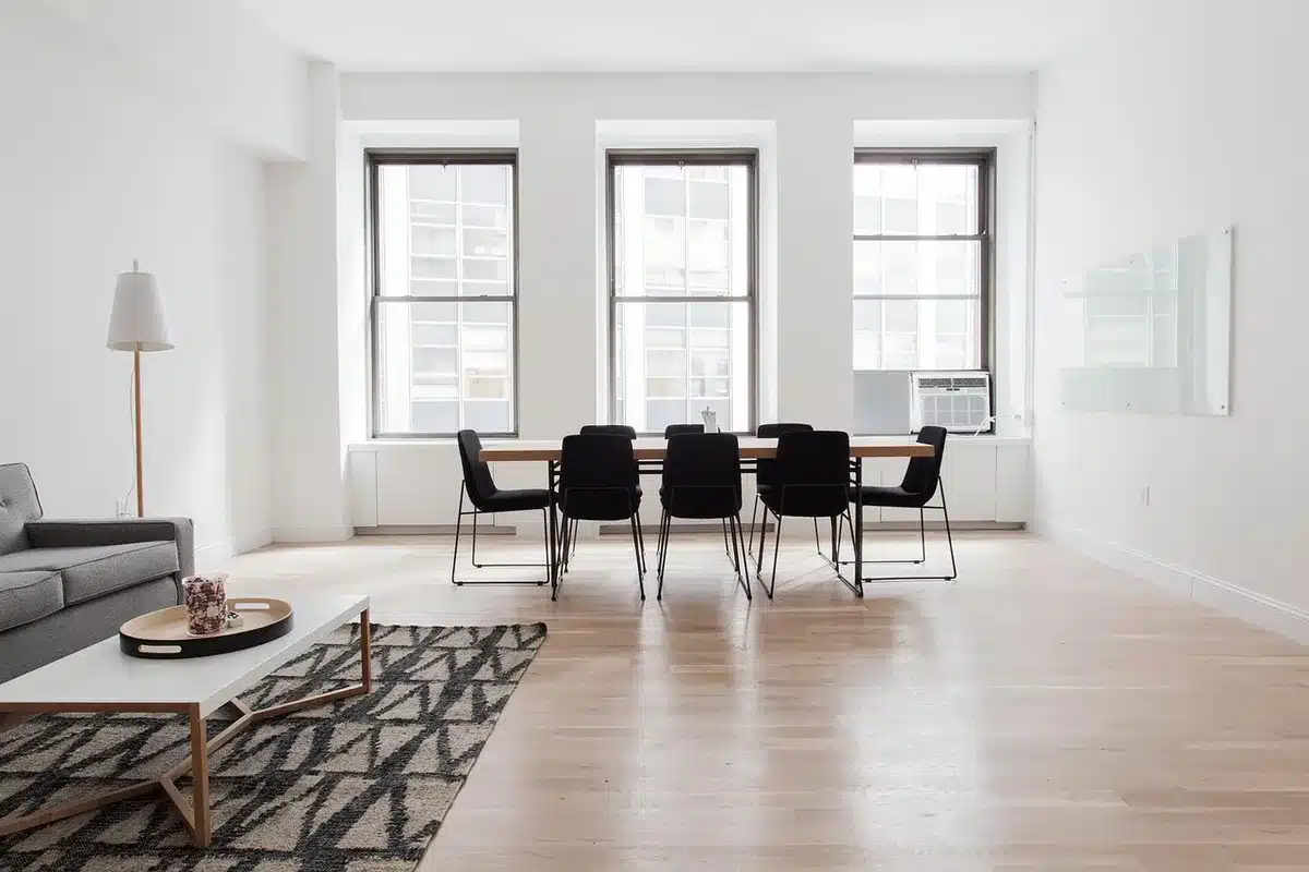 empty modern living room with an anonymous smartphone on a coffee table showing a weak wifi icon